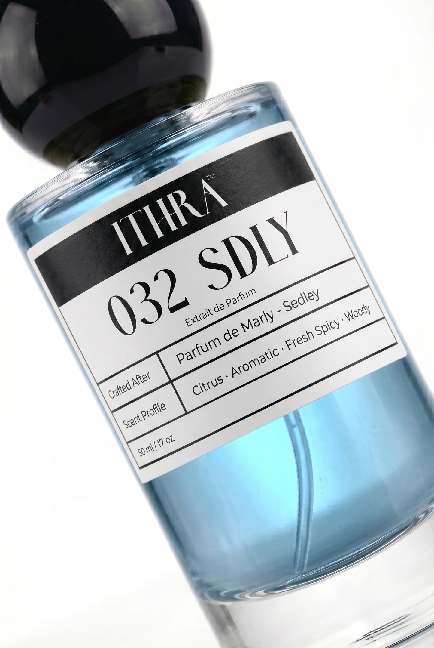 Close-up of 032 SDLY perfume label by Ithra Perfumes, citrus fresh spicy aromatic woody, available in 50ml and 100ml