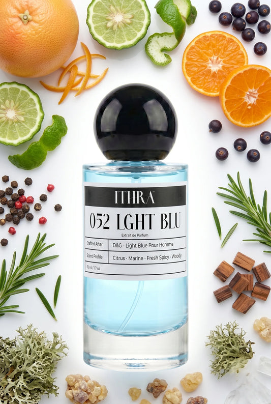 052 LGHT BLU perfume bottle styled with grapefruit, juniper, rosemary and oakmoss fragrance ingredients, airy, fresh and radiant notes