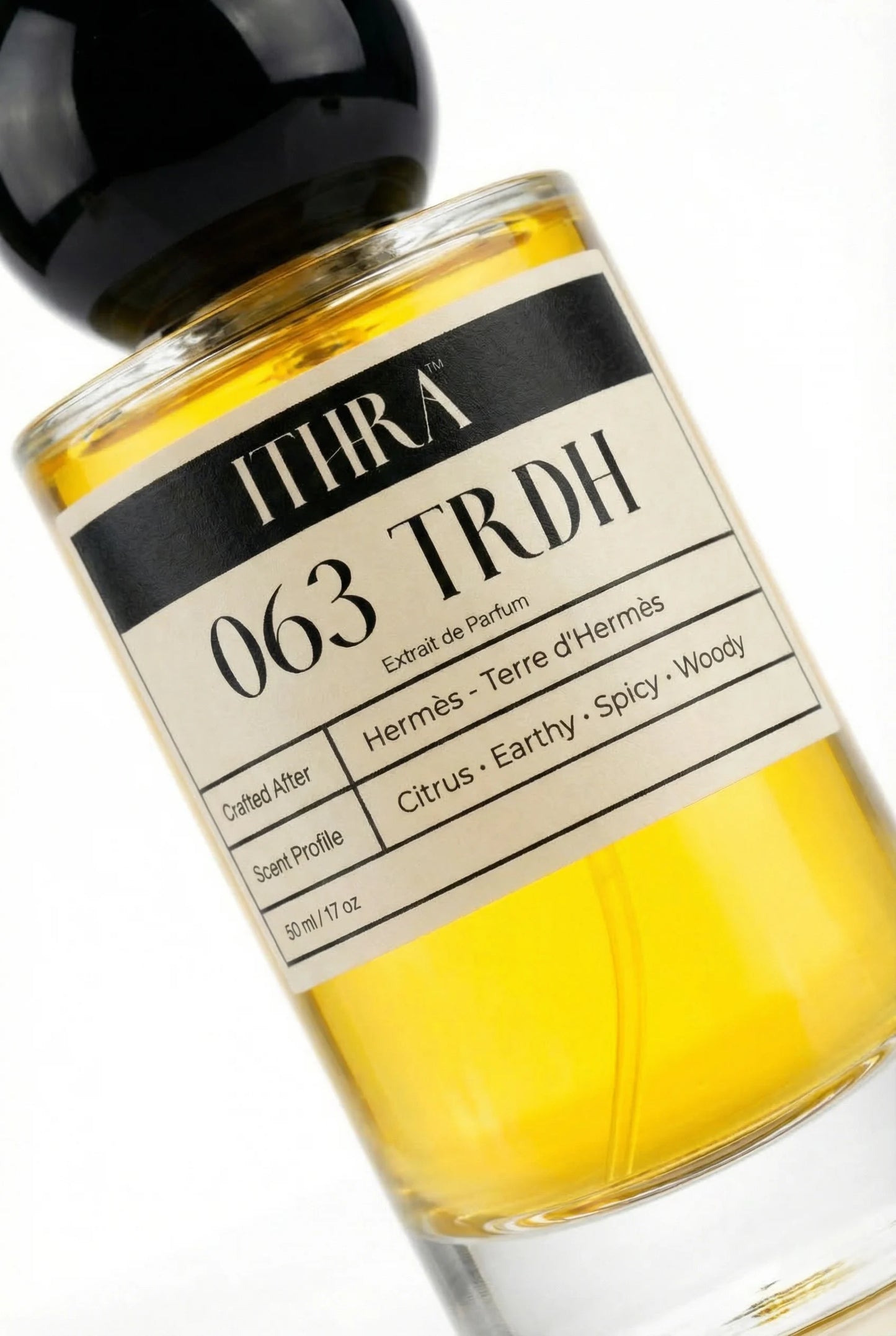 Close-up of 063 TRDH perfume by Ithra Perfumes, citrus earthy spicy woody fragrance, available in 50ml and 100ml
