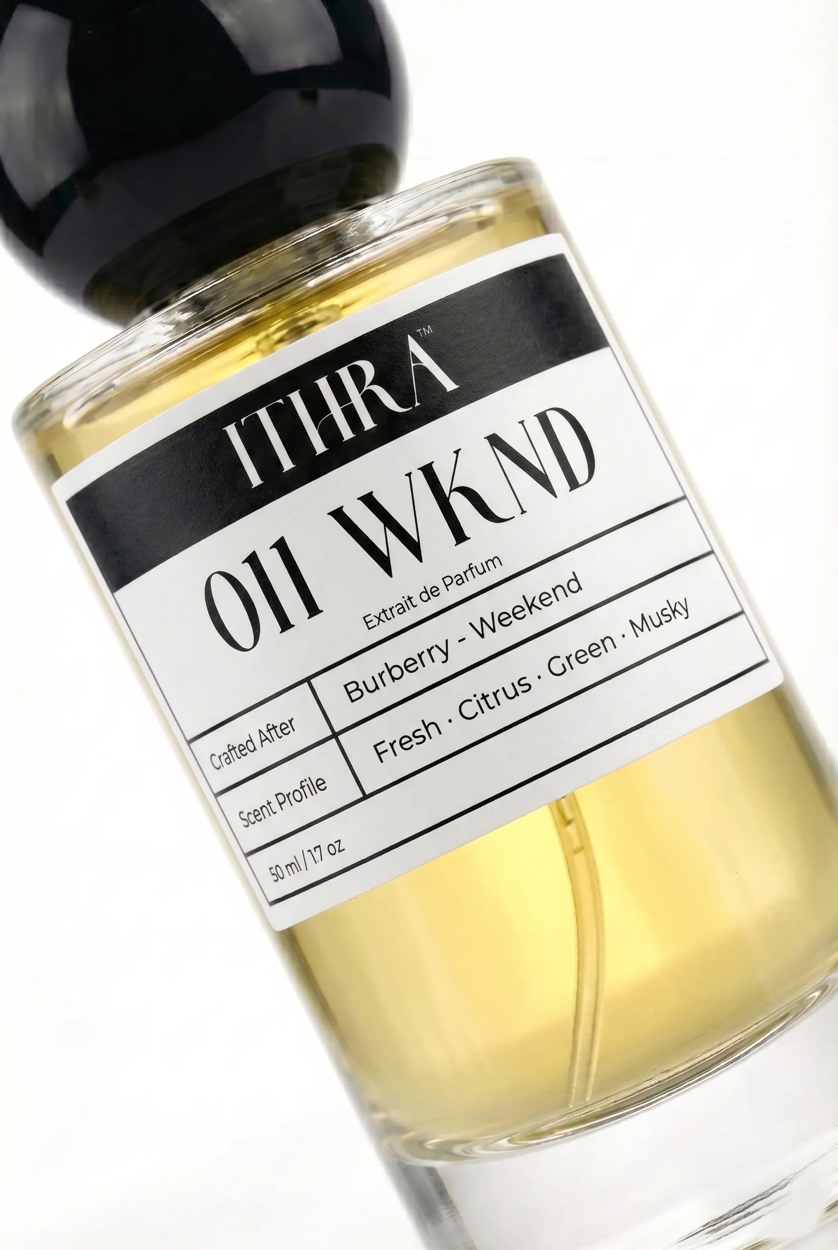 Close-up of 011 WKND perfume label by Ithra Perfumes, citrus fresh green musky, available in 50ml and 100ml