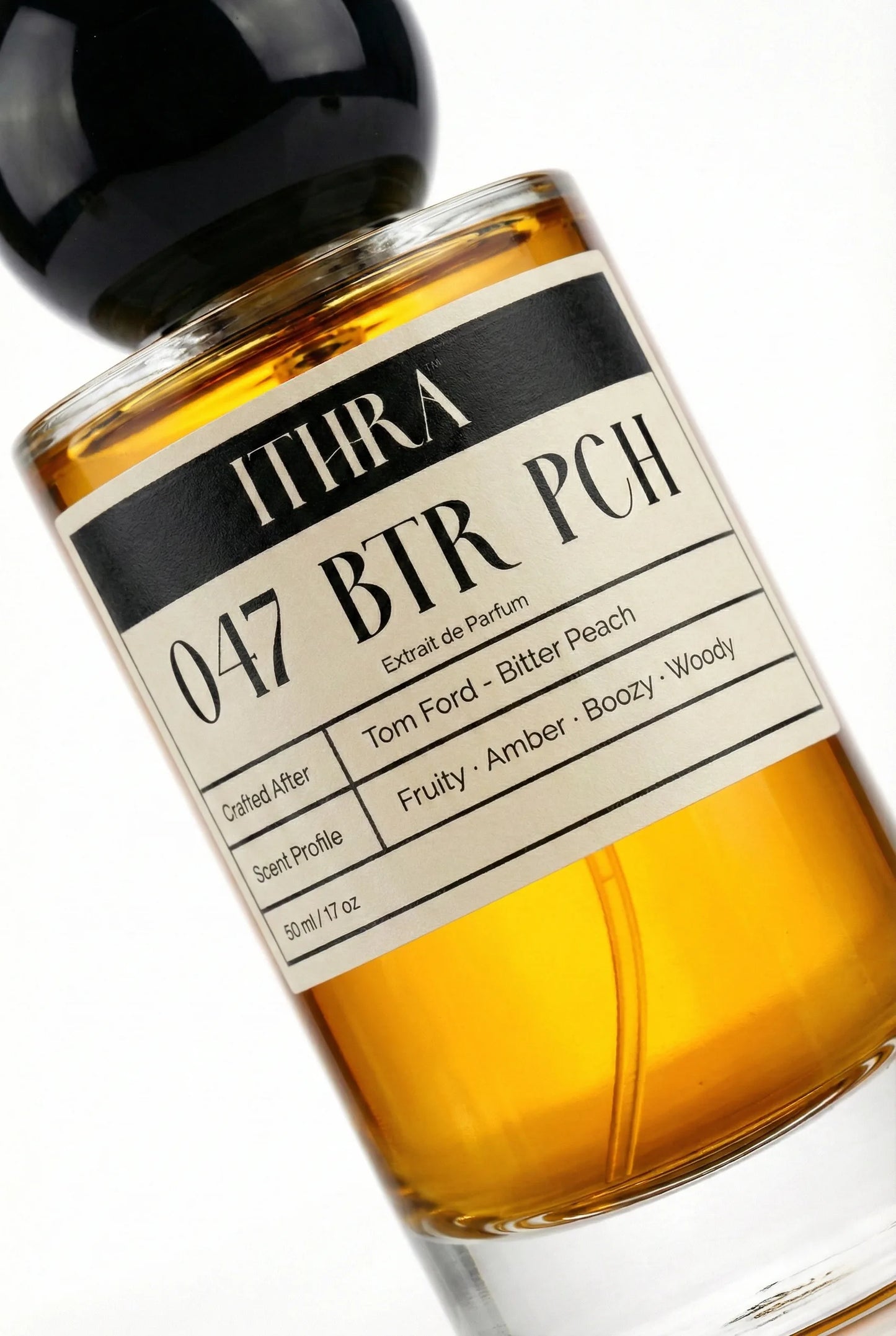 Close-up of 047 BTR PCH perfume by Ithra Perfumes, fruity amber boozy woody fragrance, available in 50ml and 100ml