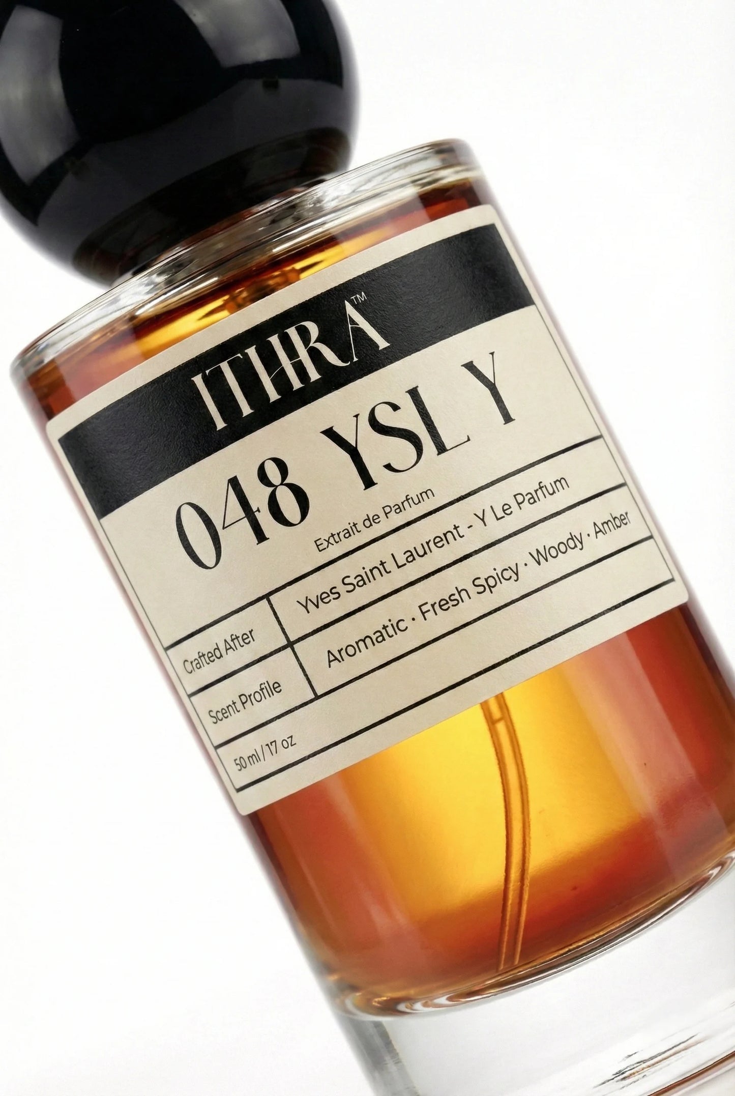 Close-up of 048 Y perfume by Ithra Perfumes, aromatic fresh spicy woody amber fragrance, available in 50ml and 100ml