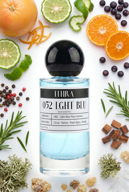 052 LGHT BLU perfume bottle styled with grapefruit, juniper, rosemary and oakmoss fragrance ingredients, airy, fresh and radiant notes