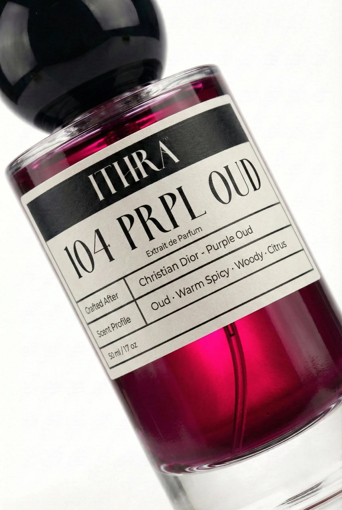 Close-up of 104 PRPL OUD label by Ithra Perfumes, oriental citrus oud warm spicy woody unisex perfume, available in 50ml and 100ml
