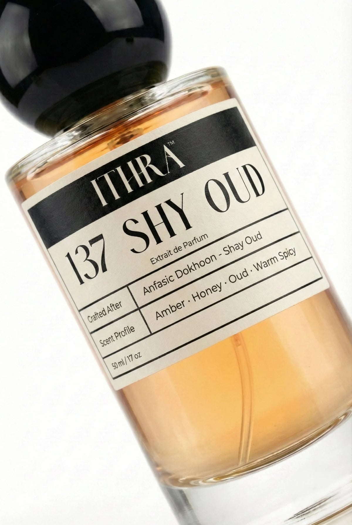 Close-up of 137 SHY OUD perfume by Ithra, soft oud honey amber warm spicy unisex perfume, available in 50ml and 100ml