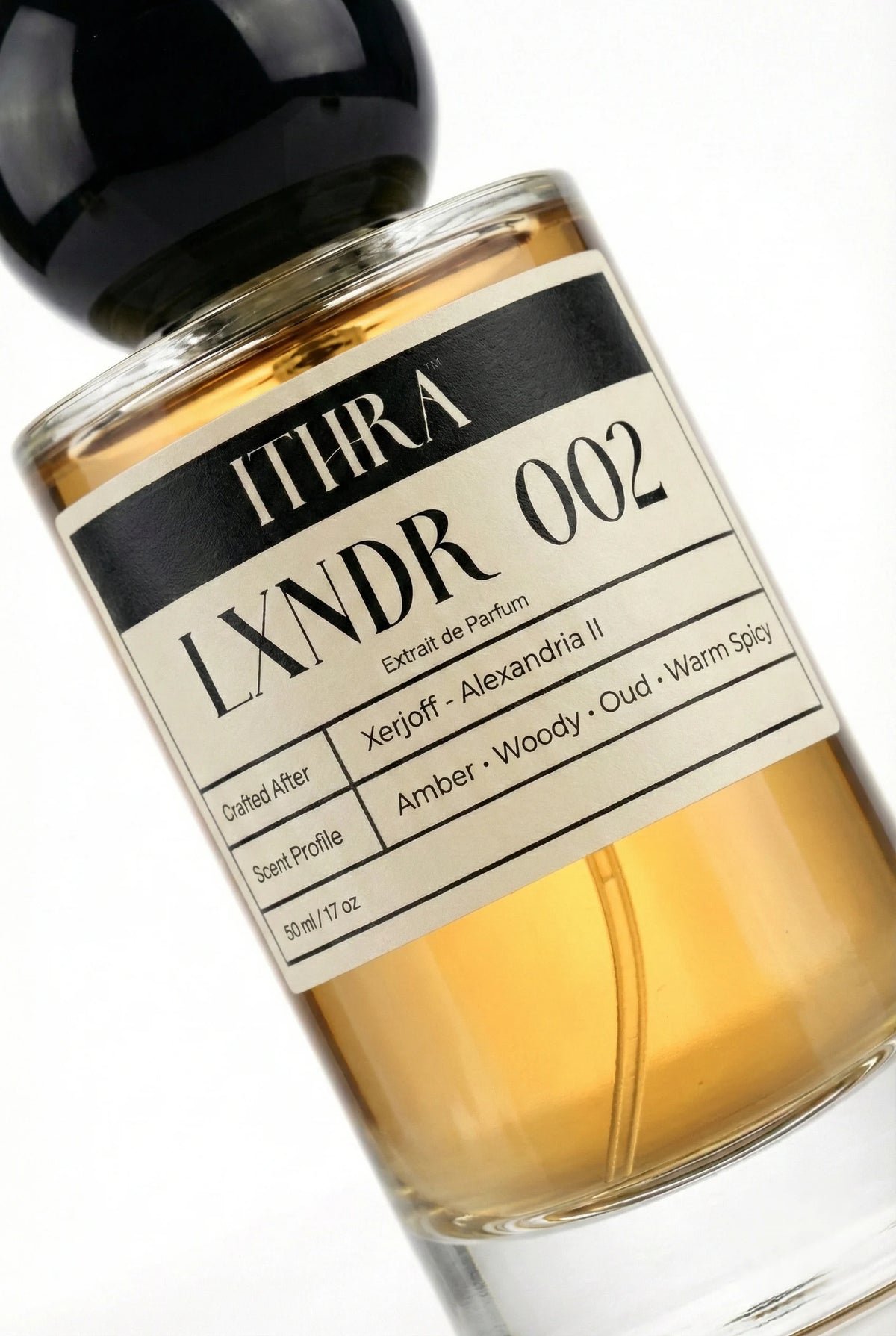 Close-up of LXNDR 002 perfume by Ithra, aromatic oriental oud amber woody warm spicy unisex perfume, available in 50ml and 100ml